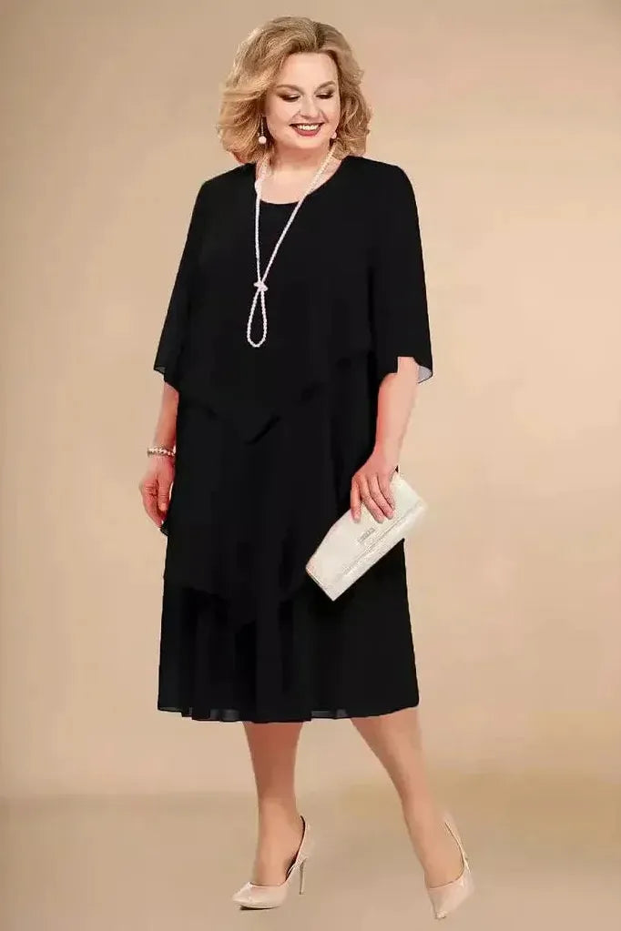 Tummy-covering dress in black, layered asymmetrical hem, elbow-sleeve, round neckline