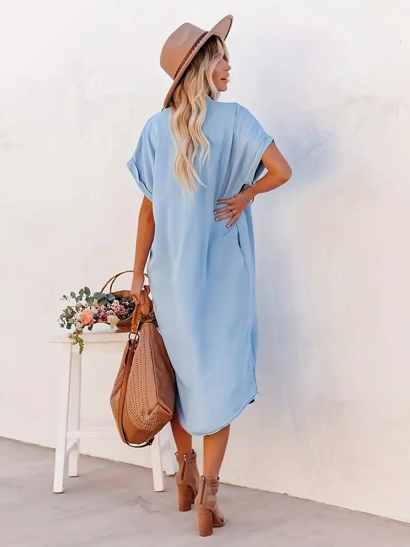 Light blue shirt dress with fixed pockets, short sleeves, button-front and collar