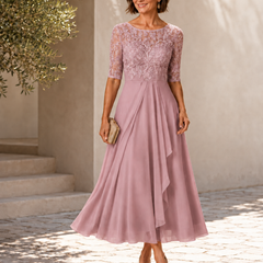 Pink lace midi dress with 3/4 sleeves, embroidered bodice and flowing layered skirt