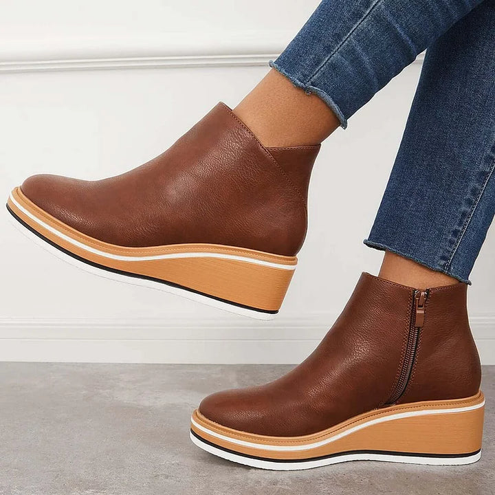 Brown leather-look ankle boots with side zipper and stacked sole trim