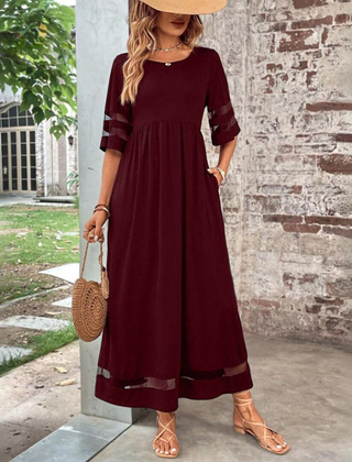 Red midi dress with gathered waist and elbow-length contrast striped sleeves.