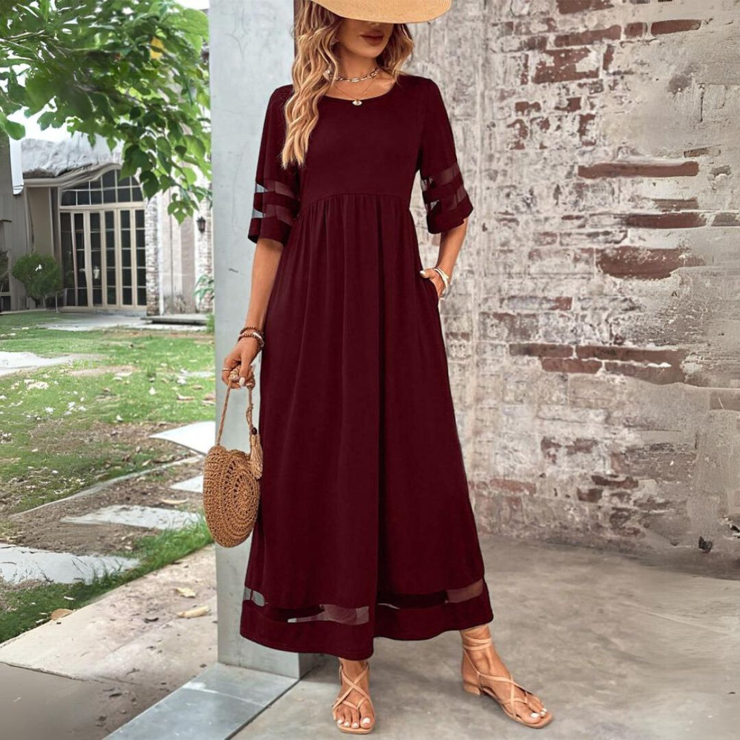 Red midi dress with gathered waist and elbow-length contrast striped sleeves.