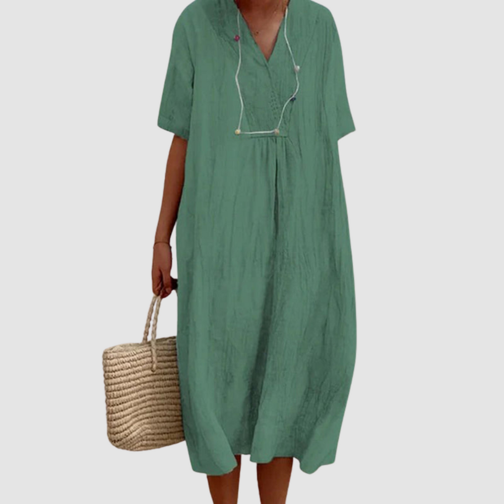 Green bohemian dress with V-neck, short sleeves, gathered waist, loose midi fit