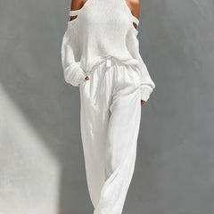 White cold-shoulder knit turtleneck top with matching drawstring trousers