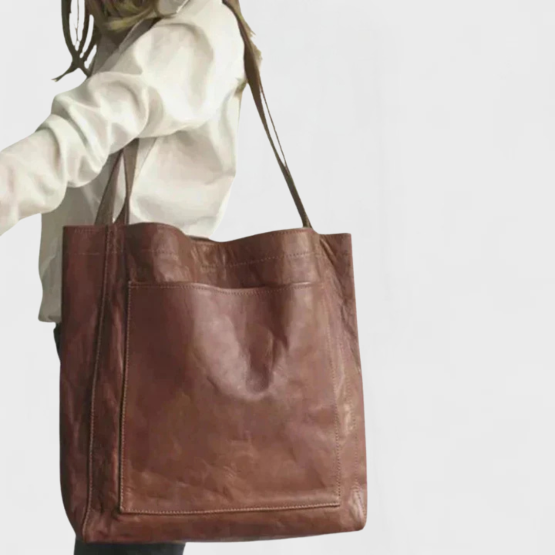 Brown leather tote bag with wide straps and square front panel