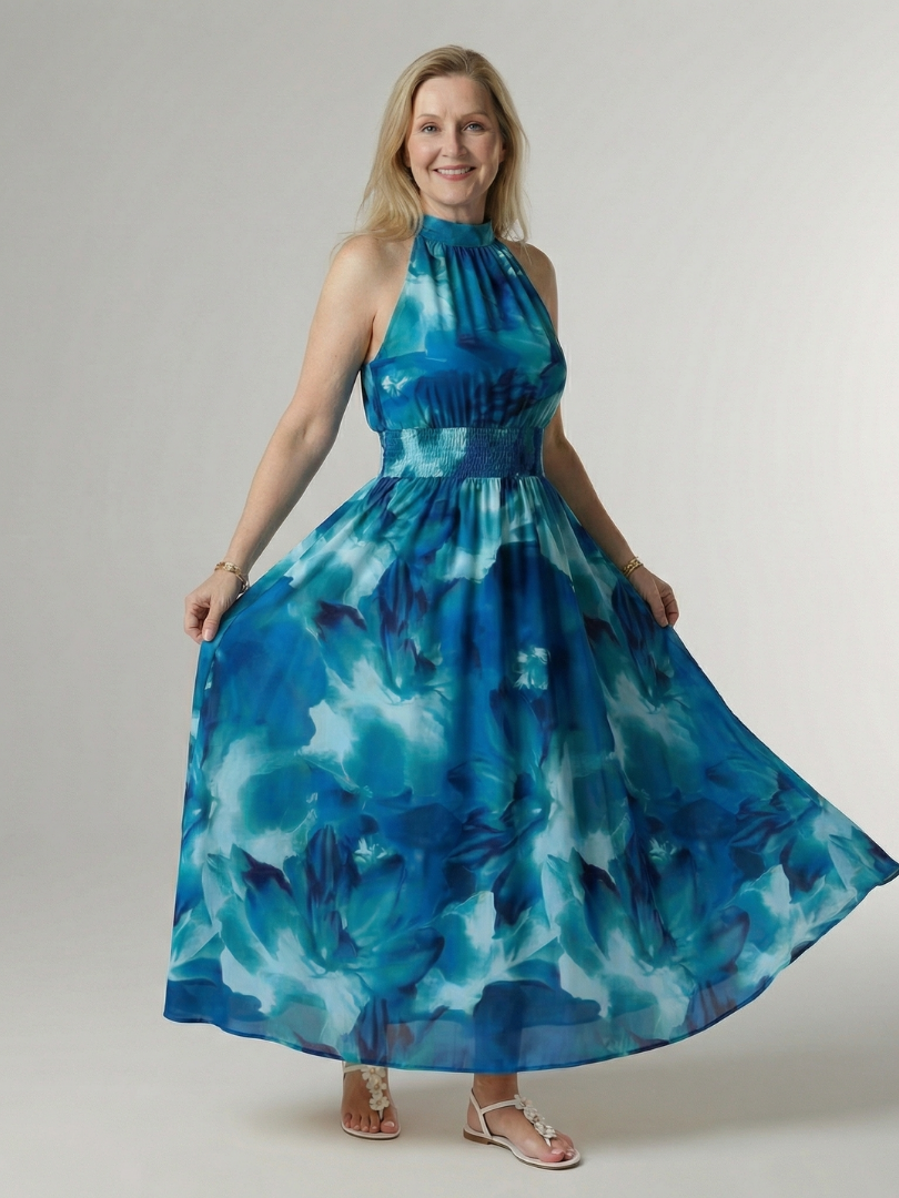 Blue tie-dye halter midi dress with gathered bodice, smocked waist, and flared skirt