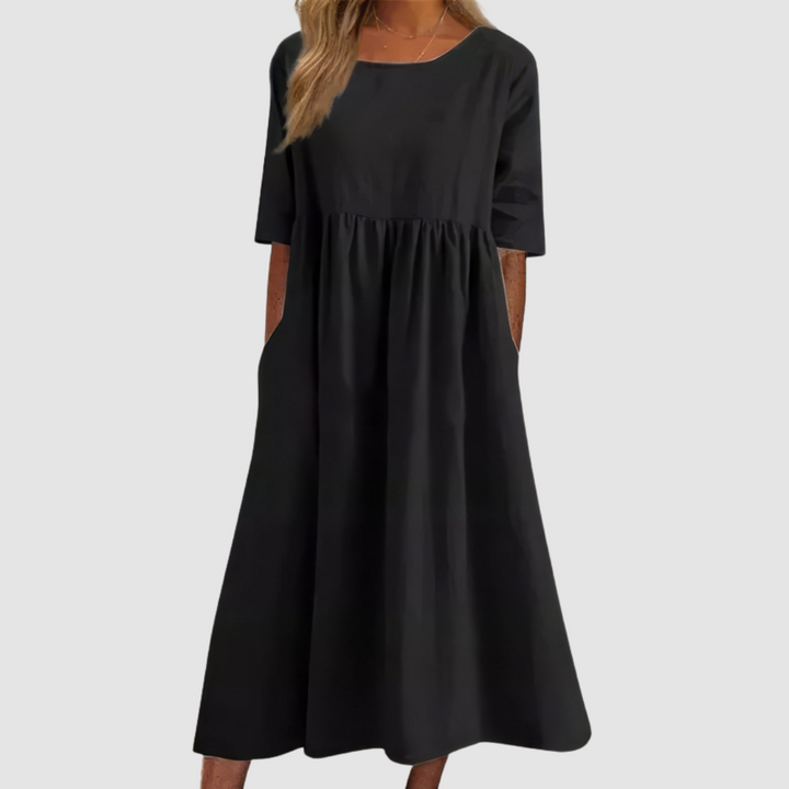 Black breezy dress with gathered waist and short sleeves, relaxed A-line maxi length