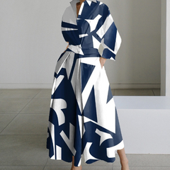 Navy and white abstract print shirt dress with long sleeves, collar, tie waist