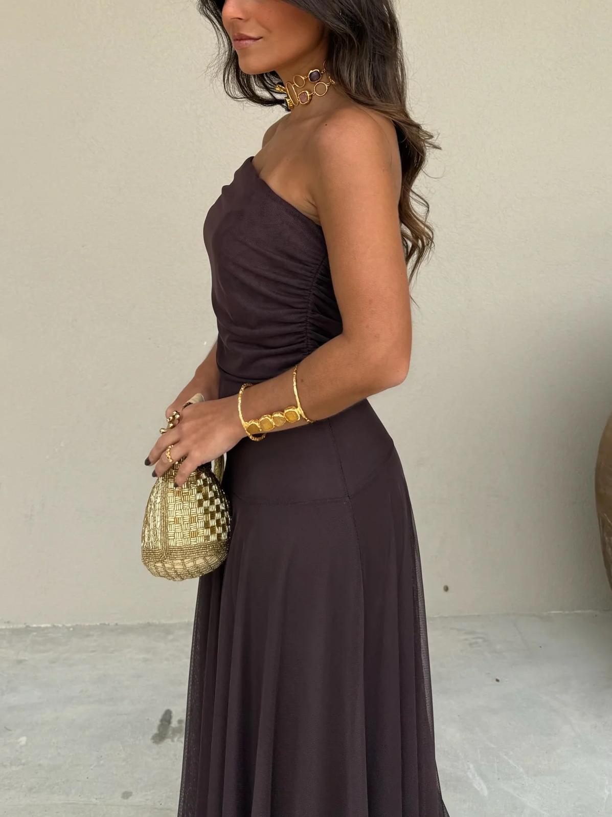 Dark plum sleeveless off-shoulder maxi dress with ruched bodice and flowing skirt
