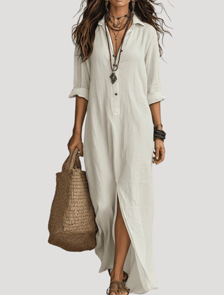 White maxi shirt dress with button front, 3/4 sleeves, and side slit