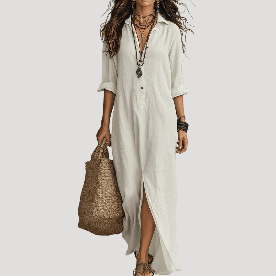 White maxi shirt dress with button front, 3/4 sleeves, and side slit