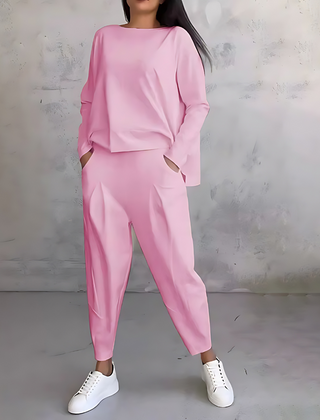 Pink two-piece lounge set with long-sleeve sweatshirt and tapered ankle jogger pants