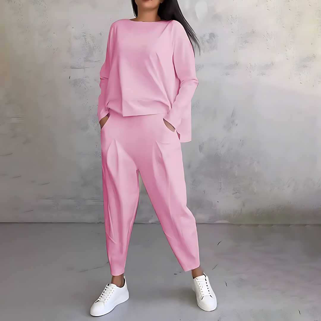 Pink two-piece lounge set with long-sleeve sweatshirt and tapered ankle jogger pants