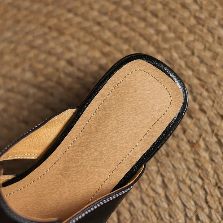 Apricot leather mule interior footbed with black trim and stitched edge