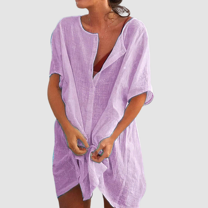 Purple soft loose fit dress with V-neck, short sleeves, and front tie knot.