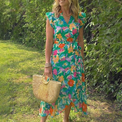 Floral V-neck tiered midi dress in teal with pink and orange flowers, tied waist, cap sleeves