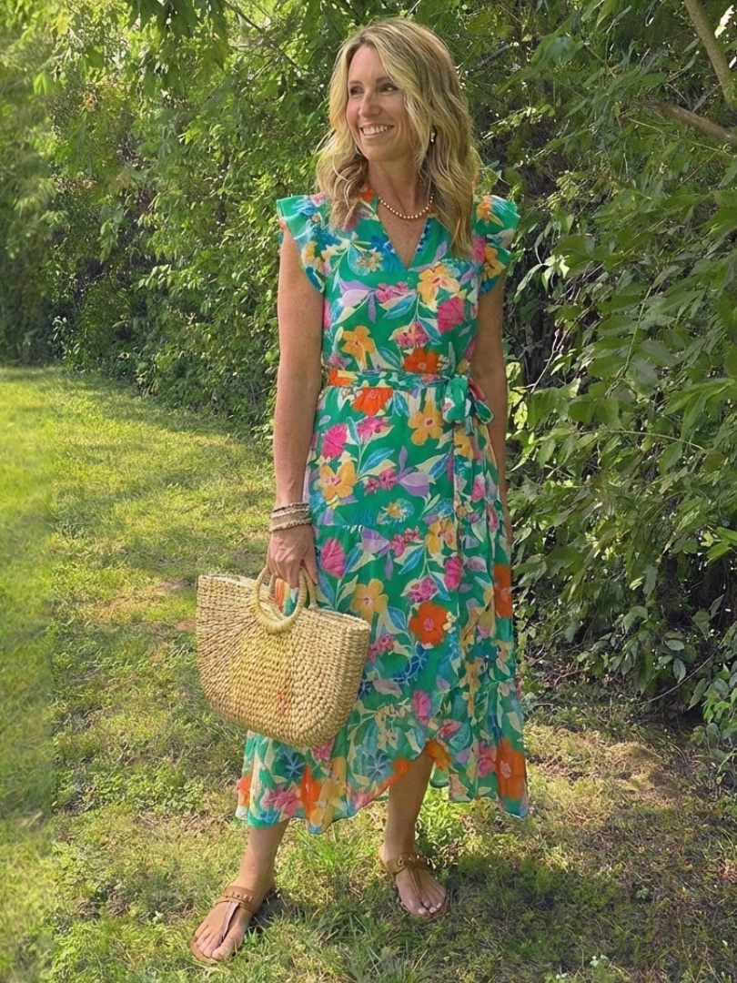 Floral V-neck tiered midi dress in teal with pink and orange flowers, tied waist, cap sleeves
