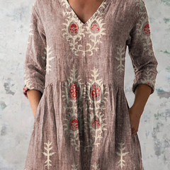 Rose long-sleeve V-neck embroidered blouse with gathered waist and folk floral motifs