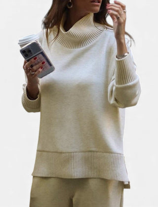 Women's white knit lounge set with turtleneck-style pullover and matching pants