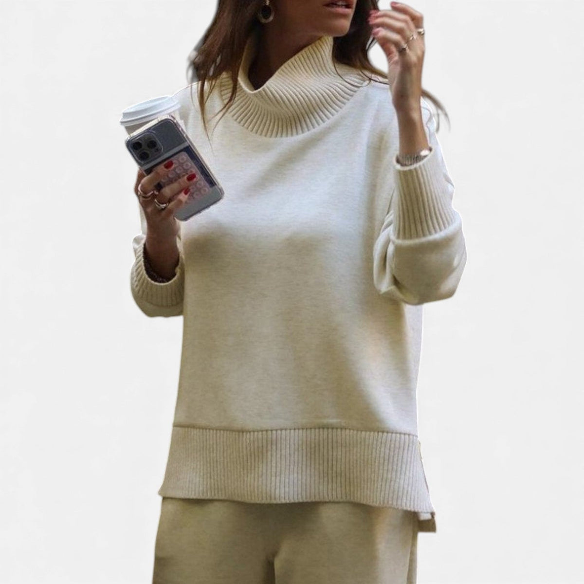 Women's white knit lounge set with turtleneck-style pullover and matching pants