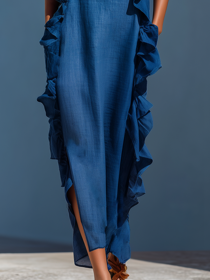 Blue maxi dress front view with tiered ruffle trim along sides and skirt hem