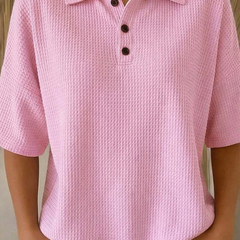 Pink waffle knit polo blouse with short sleeves, pointed collar, three-button placket