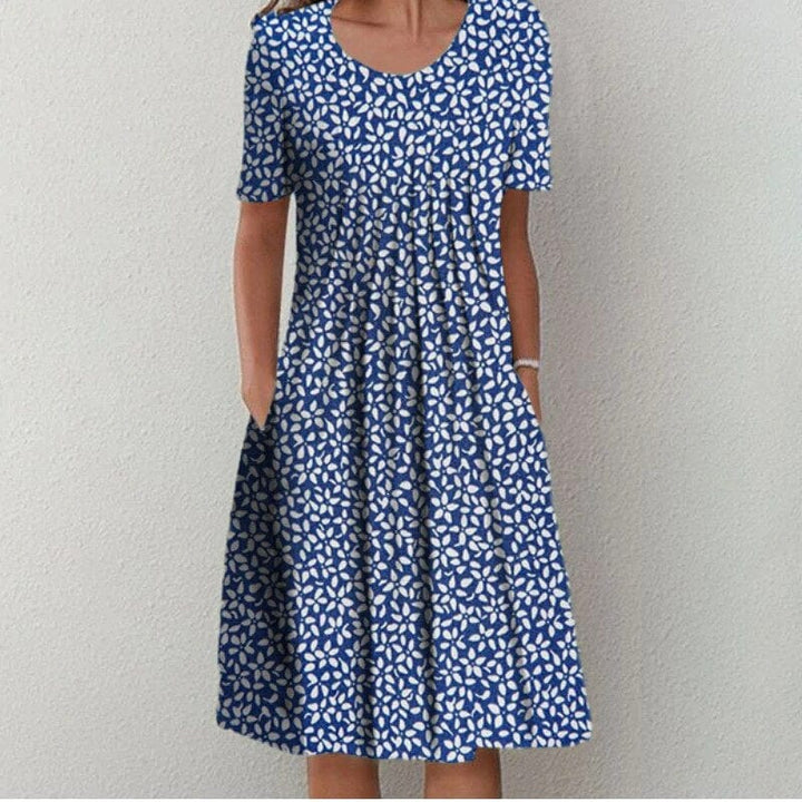 Blue patterned dress with scoop neck, short sleeves, gathered A-line skirt