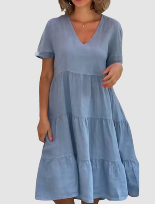 Blue V-neck short-sleeve soft dress with tiered ruffle panels and A-line fit