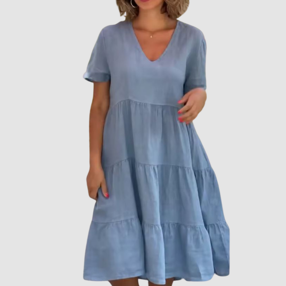 Blue V-neck short-sleeve soft dress with tiered ruffle panels and A-line fit