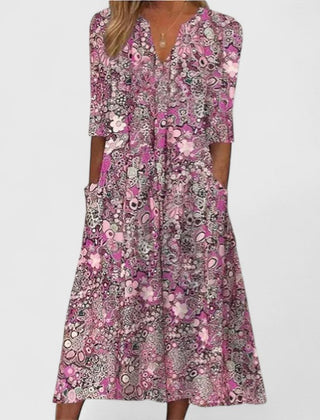 Pink patterned summer dress with V-neck, three-quarter sleeves, center button placket