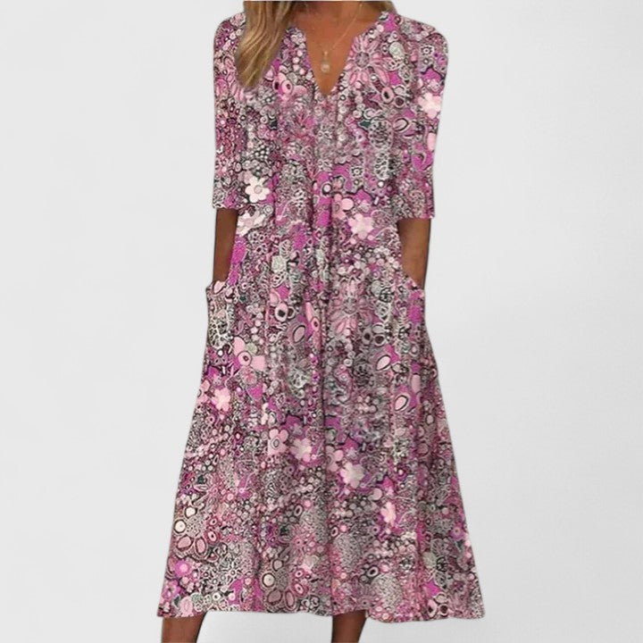 Pink patterned summer dress with V-neck, three-quarter sleeves, center button placket