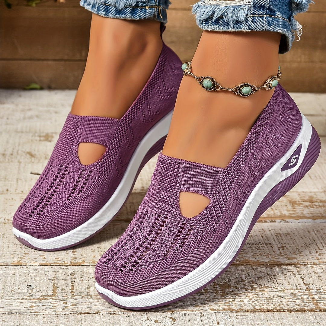 Purple knit orthopedic slip-on shoes with oval cutouts and white sole