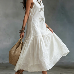 White sleeveless maxi dress with dragonfly embroidery and layered tiered hem