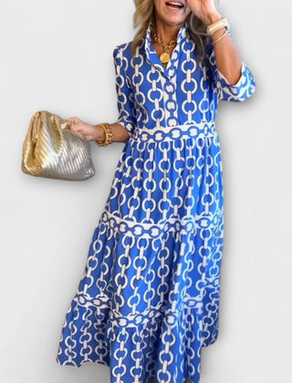 Blue chain-print midi dress with short sleeves and tiered skirt