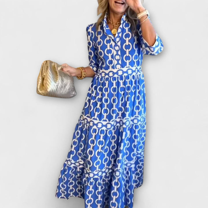 Blue chain-print midi dress with short sleeves and tiered skirt
