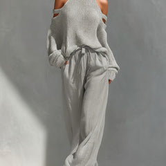 Light gray cold-shoulder knit turtleneck top with matching drawstring trousers