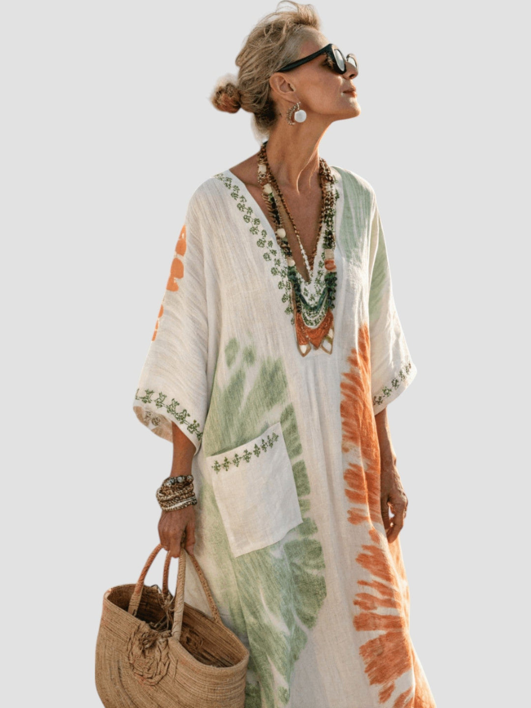 White V-neck midi dress with green floral print blocks and orange sleeve accents