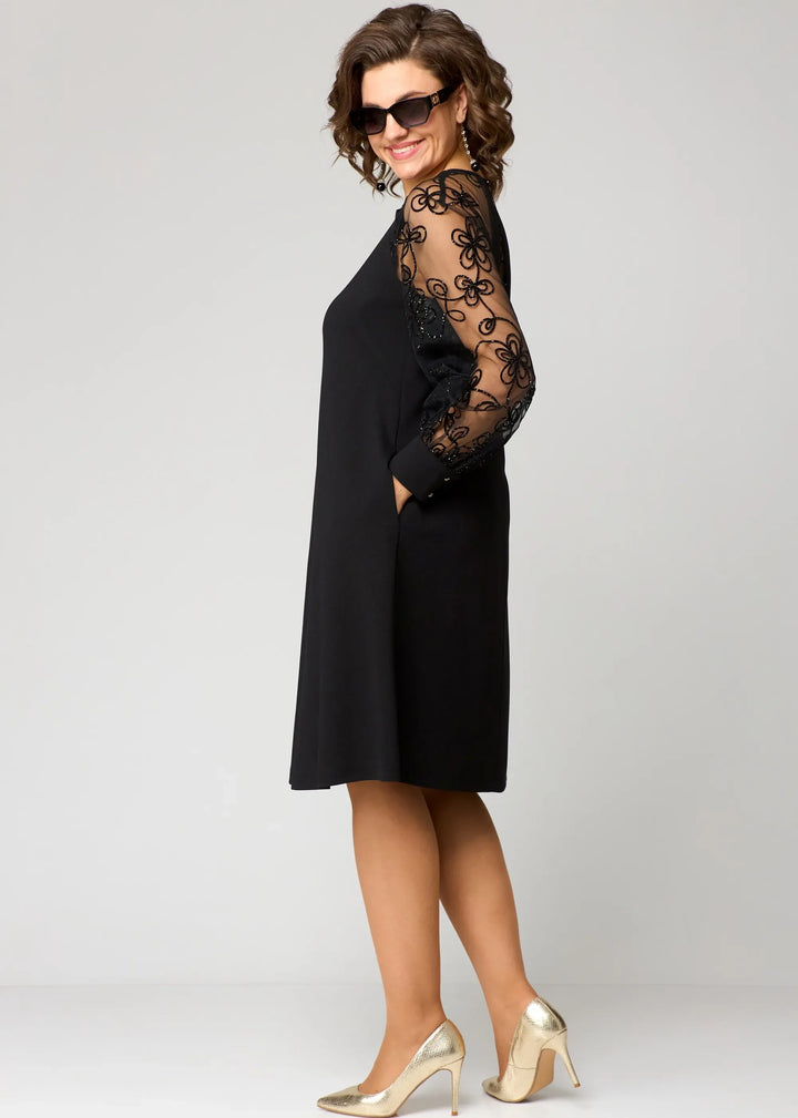 Black lace long-sleeve midi dress with flared skirt and closed neckline