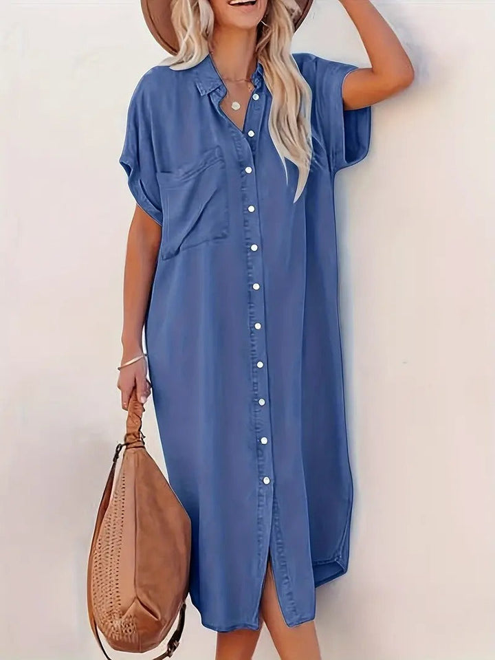 Blue shirt dress, button placket and fixed pockets at chest with flap design
