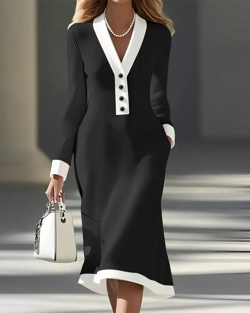 Black long-sleeve V-neck dress with white contrast hem and button placket
