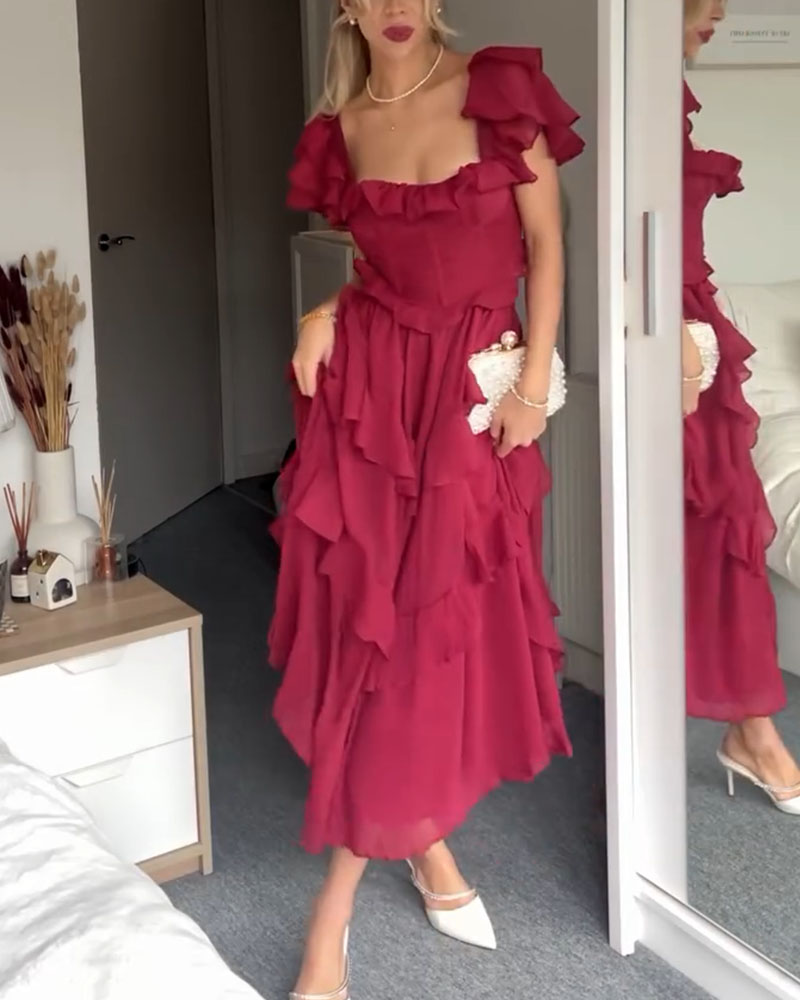Magenta ruffle midi dress with layered cap sleeves and a tiered skirt