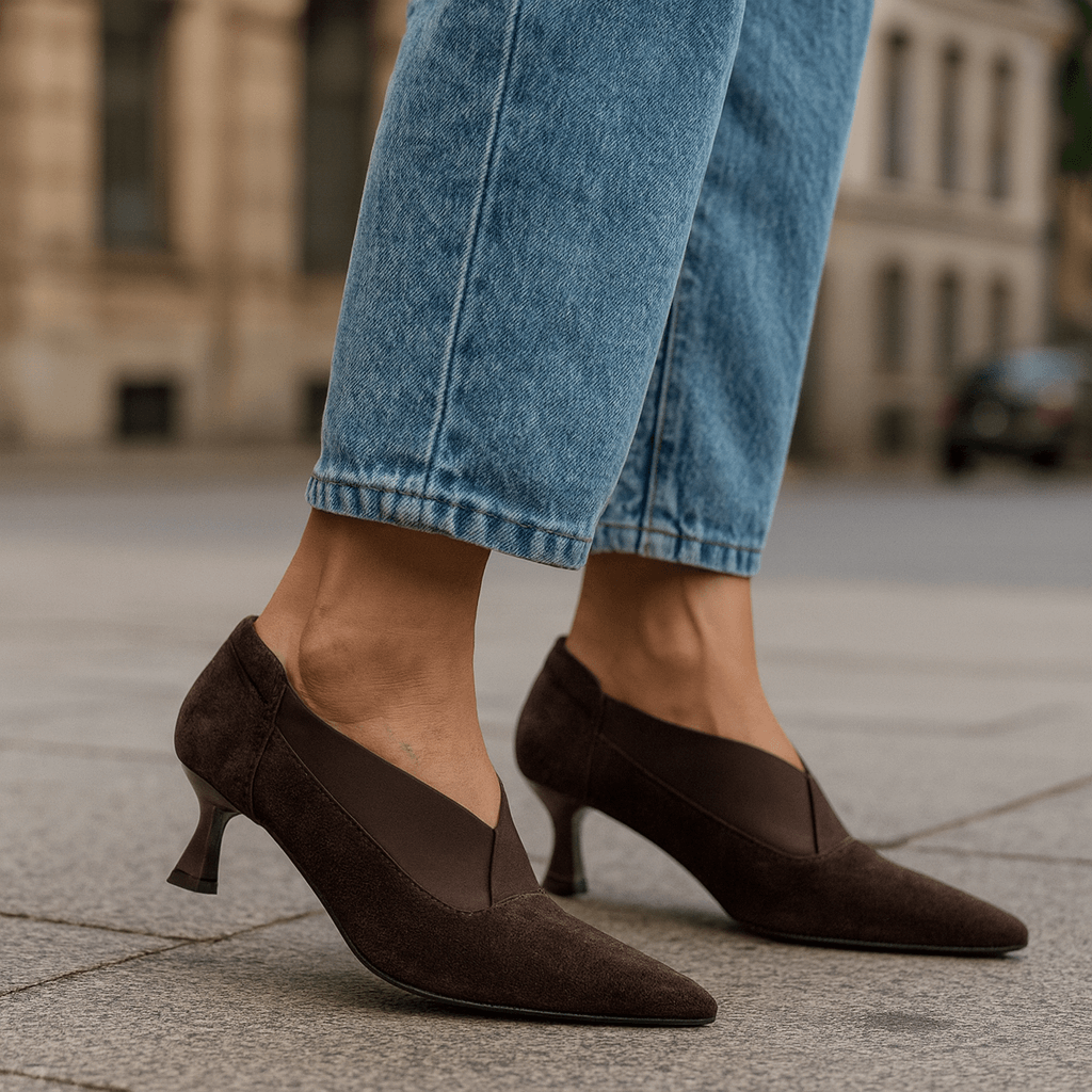 Dark brown suede pointed-toe heeled shoes with slim heel and elastic side panels