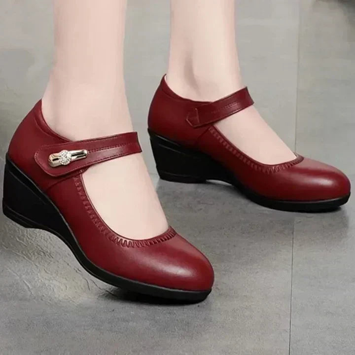 Red mid-heel Mary Jane comfort shoes with T-strap and decorative buckle detail
