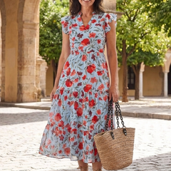 Floral V-neck tiered midi dress outdoors, light blue base with red and coral flower print