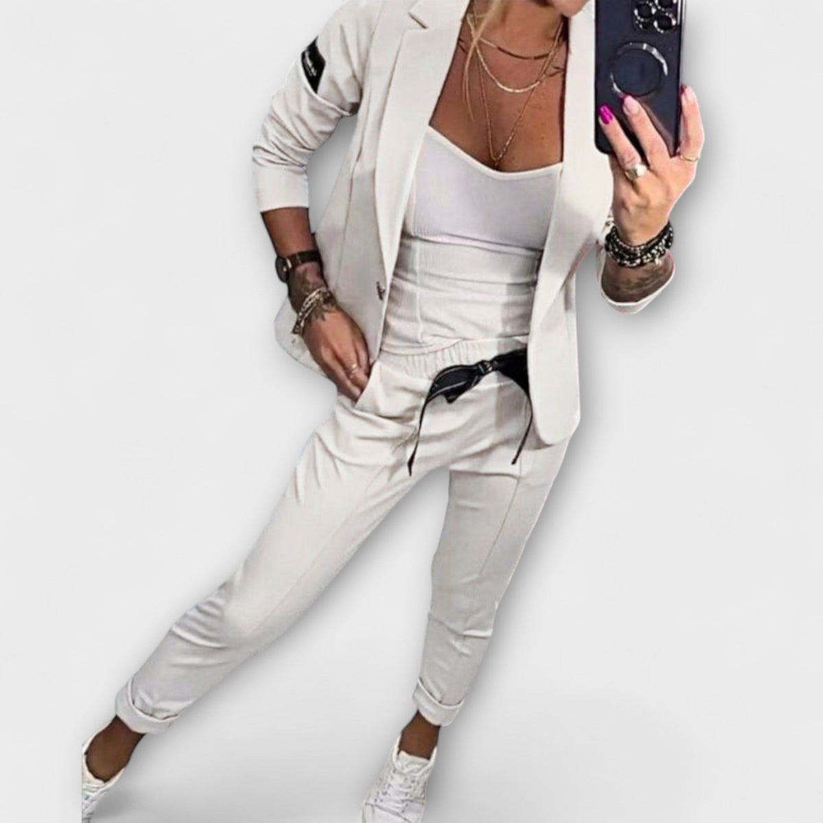 Off-white blazer and pants set with white camisole top, tailored fit, 3/4 sleeves.