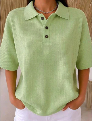 Light green waffle knit polo blouse with short sleeves, pointed collar, three-button placket