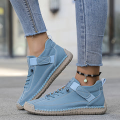 Orthopedic comfort sneaker in light blue with lace-up and hook-and-loop strap.