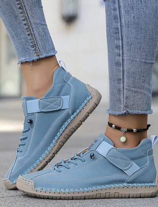 Orthopedic comfort sneaker in light blue with lace-up and hook-and-loop strap.