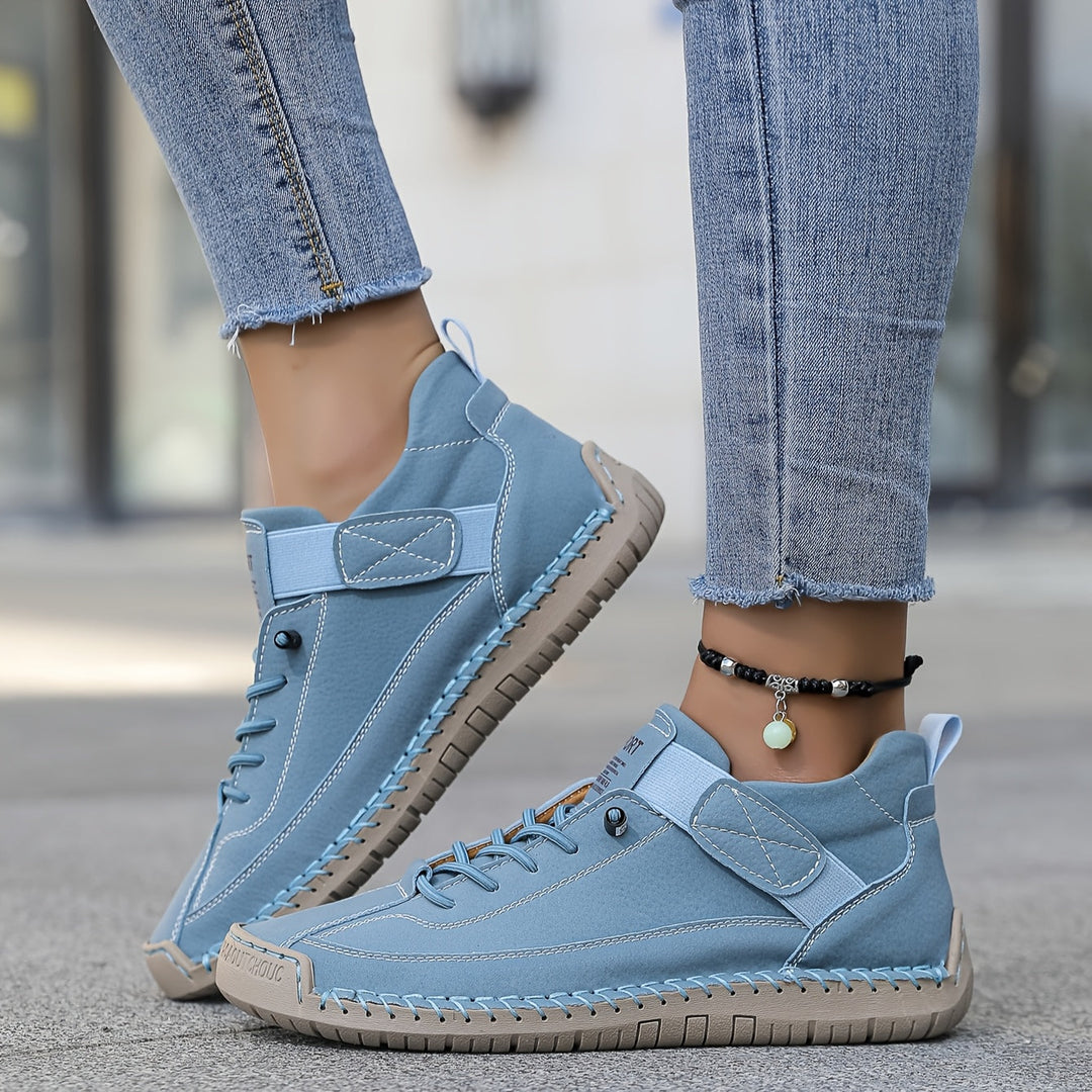 Orthopedic comfort sneaker in light blue with lace-up and hook-and-loop strap.
