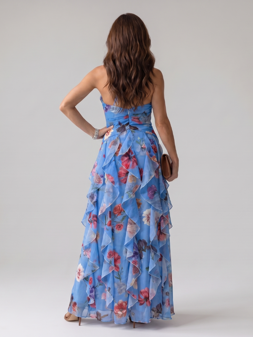 Blue halter-neck floral maxi dress back view with ruched waist and tiered ruffles